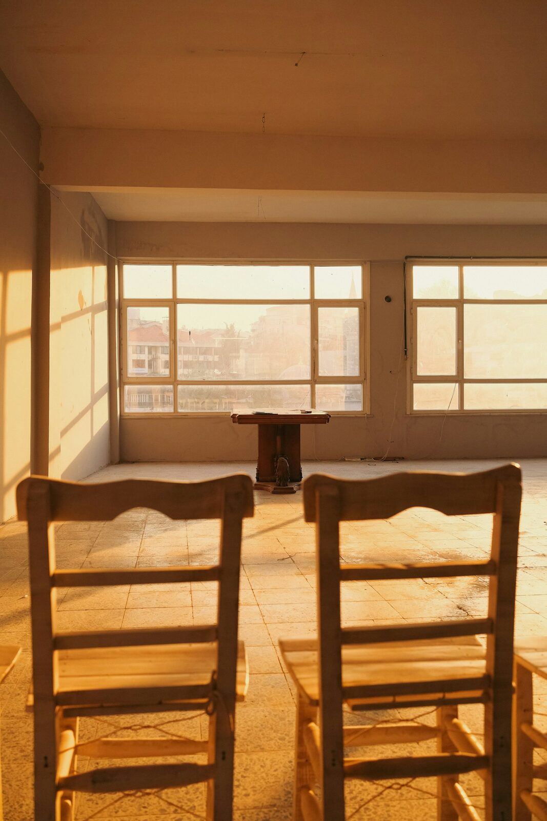 Two chairs facing each other — a confidential coaching conversation